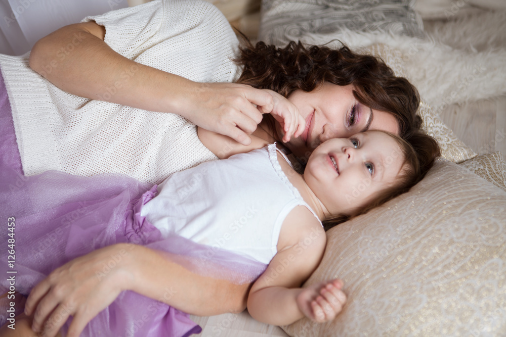 Happy loving family. mother and child girl playing and hugging
Happy loving family. mother and child girl playing and hugging