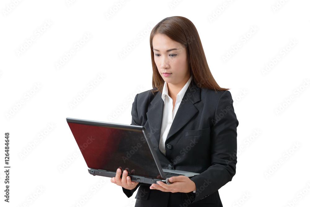 young business woman, standing wearing a white shirt and black suit holding a laptop pc. White background young business woman, standing wearing a white shirt and black suit holding a laptop pc. White background