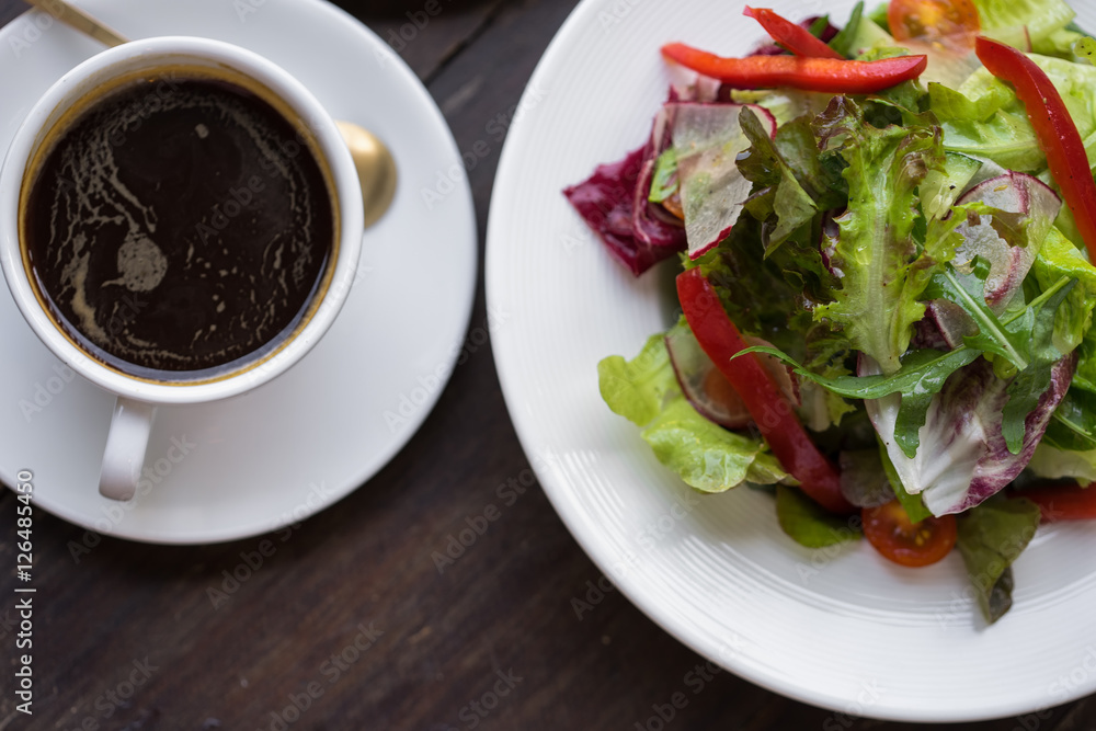 Lettuce leaves the seasoned with oil and two black coffee. Lunch. Lettuce leaves the seasoned with oil and two black coffee. Lunch.