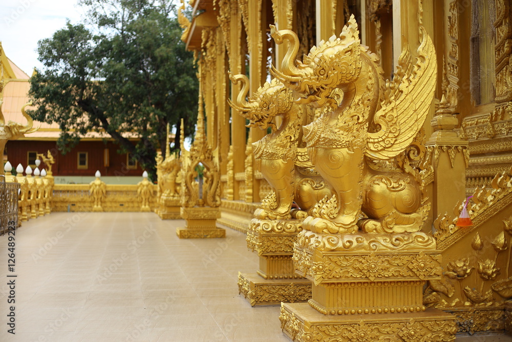 gold color Bird Kodchasri of Wat Pak Nam Jolo in Chachoengsao at Thailand.
