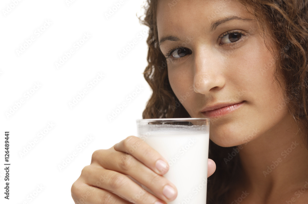 Woman holding glass of milk