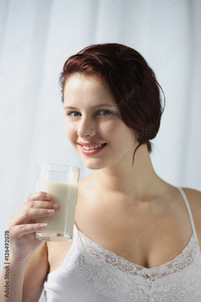 Woman with glass of milk