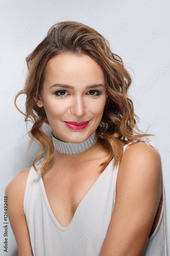 Curly hair fashion model with natural makeup and red lips Curly hair fashion model with natural makeup and red lips
