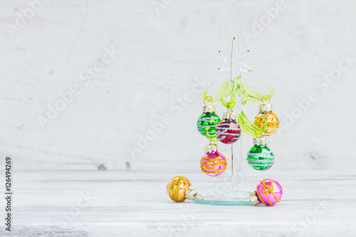 christmas tree with balls on aged wooden background