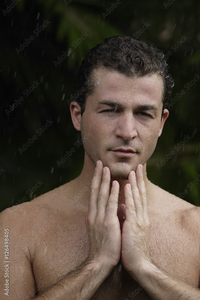 Naklejka premium man having outdoor shower