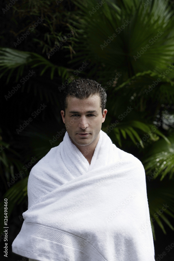 man wrapped in towel