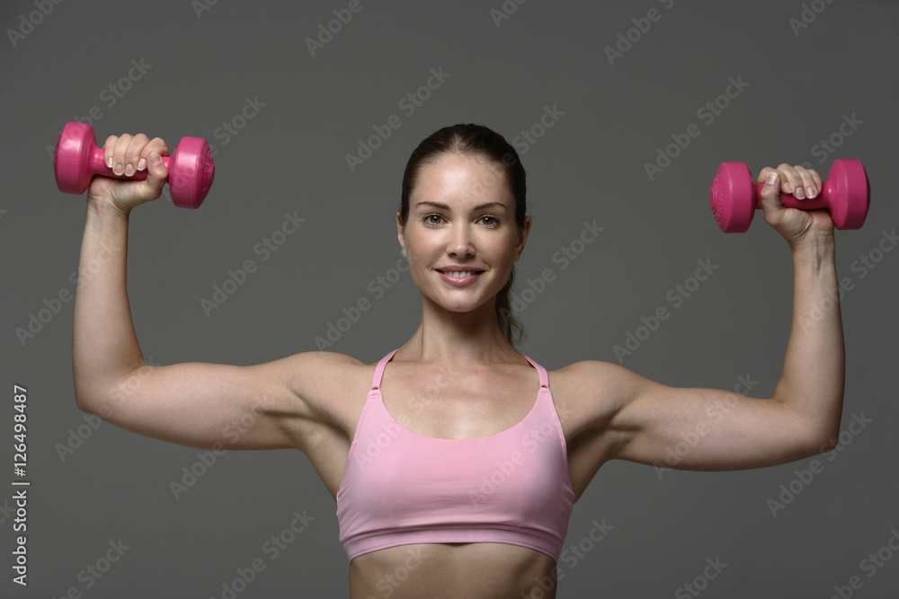 Woman working out with weights Woman working out with weights