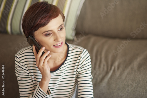 Cheerful woman talking on the phone