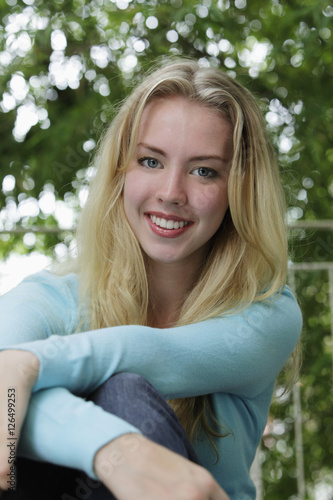 Portrait of smiling young woman with blonde hair