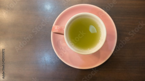 hot green tea in pink cup