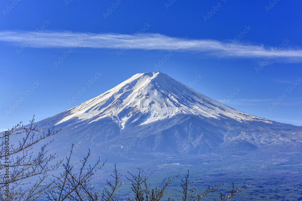 Stunning view of Fuji mountain taken from Kawaguchiko mt's scenic point, in clear blue sky with haze and smoke effect at the bottom of mountain. Stunning view of Fuji mountain taken from Kawaguchiko mt's scenic point, in clear blue sky with haze and smoke effect at the bottom of mountain.
