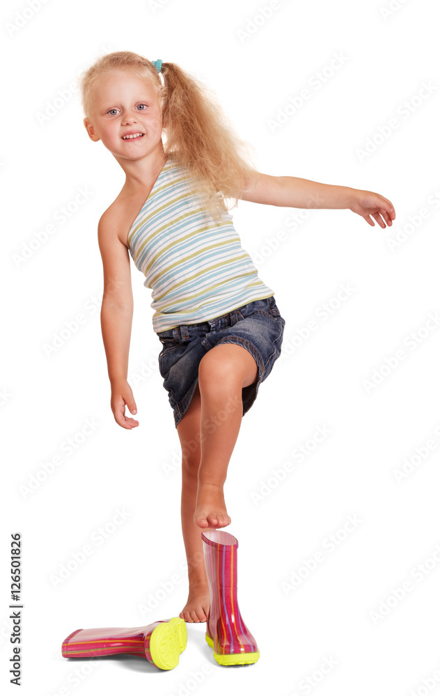 Naklejka premium Charming little blond girl by wearing rubber boots isolated.