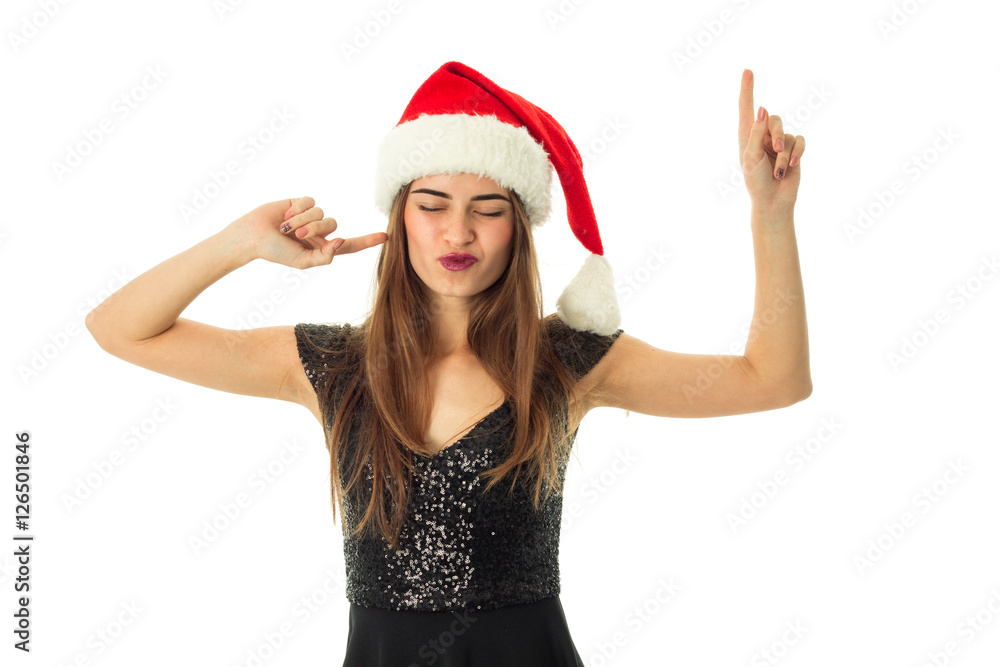 portrait of cheerful young woman in santa hat portrait of cheerful young woman in santa hat