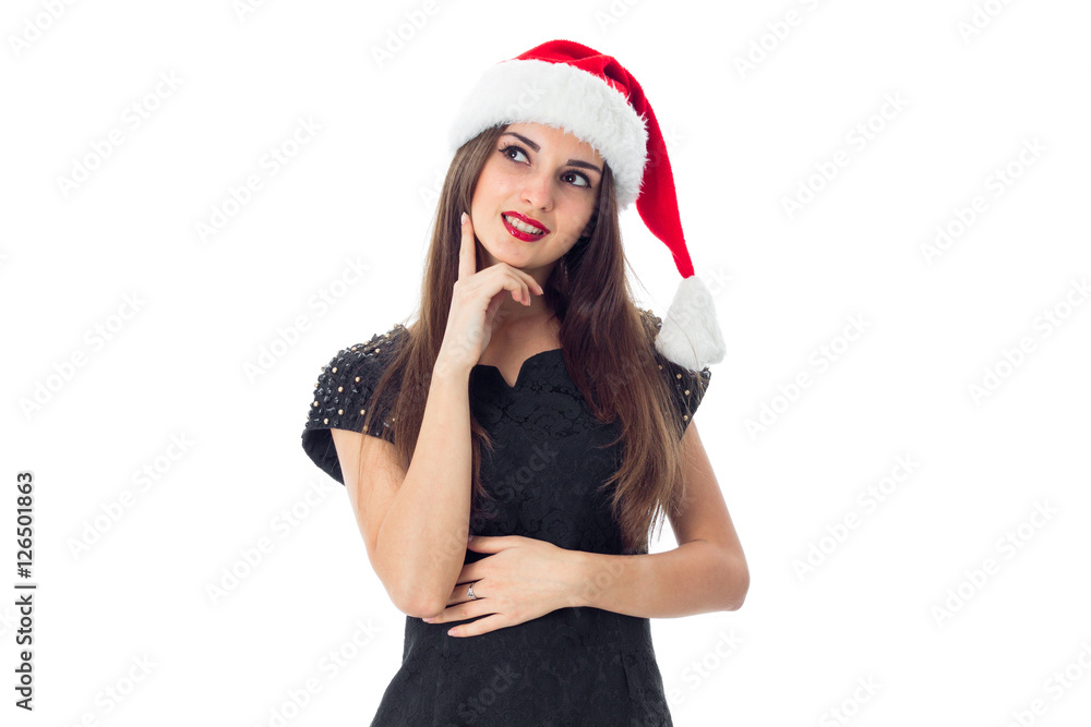 brunette girl in santa hat smiling brunette girl in santa hat smiling