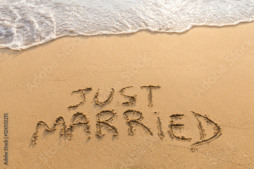 Just married written in the sand, tropical beach, honeymoon travel