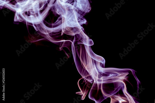 Abstract pink and purple smoke on a black background.