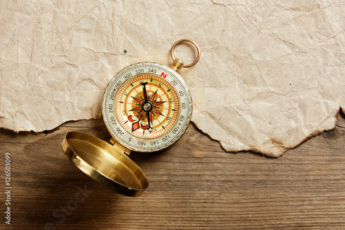 compass, old paper and rope