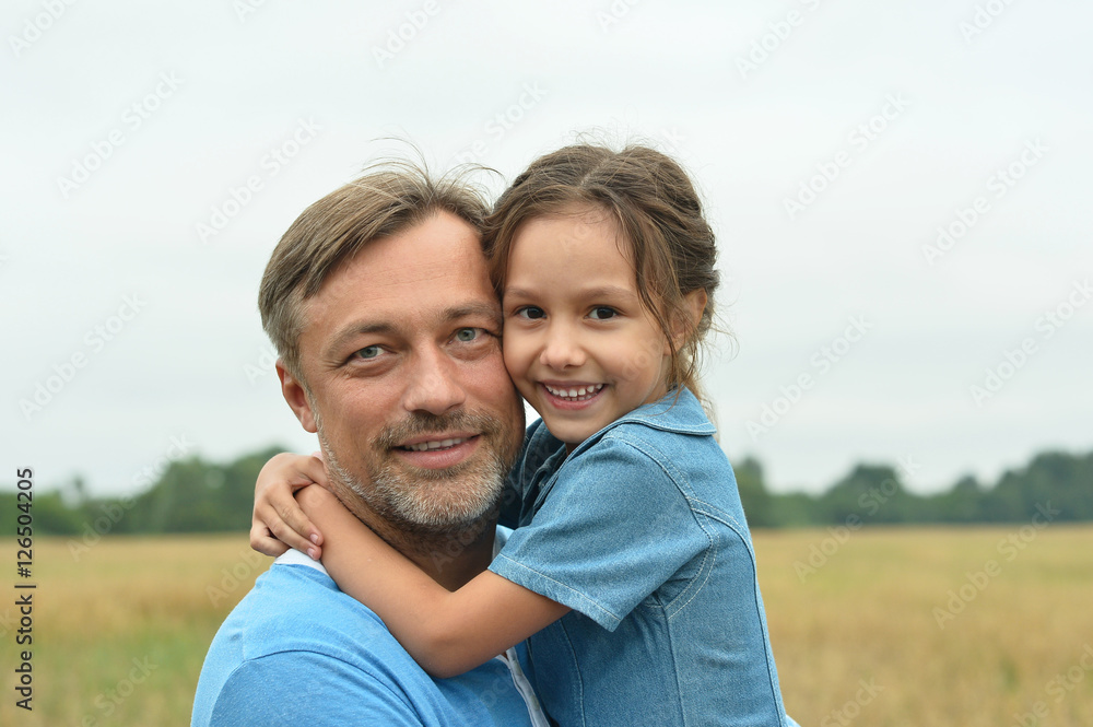 Dad with daughter in field