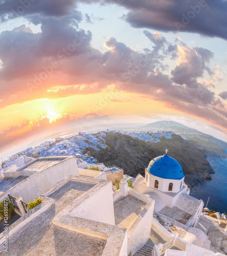 Old Town of Thira on the island Santorini  famous church against colorful sunset in Greece