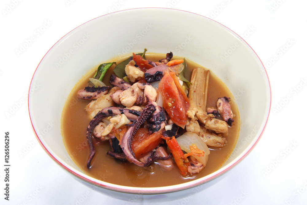 Thai style hot and sour soup Spicy squid isolated on white background Thai style hot and sour soup Spicy squid isolated on white background