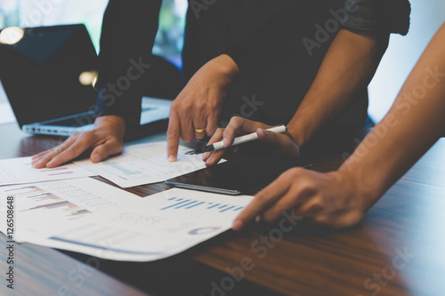 businessman working with document, tablet and computer in office