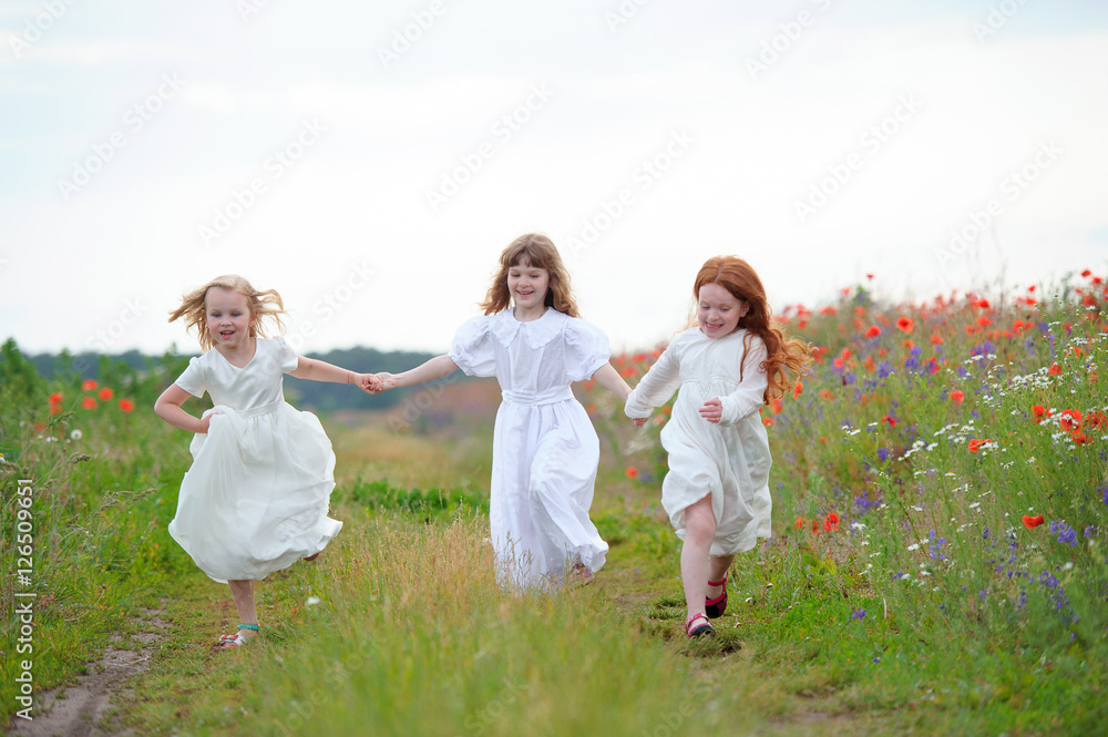 happy children friends sisters run and play outdoors on the mead happy children friends sisters run and play outdoors on the mead