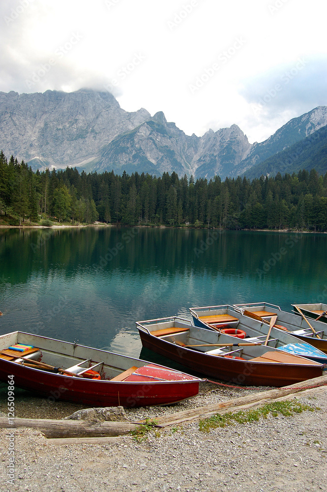 Rowboats in the Fusine Lake (Lago di Fusine) in Julian Alps, Tarvisio, Friuli, Italy