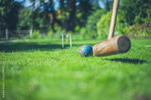 Croquet mallet hitting ball