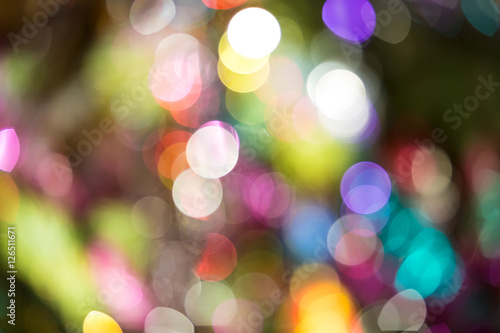 Defocused background decorated Christmas tree. The idea for postcards