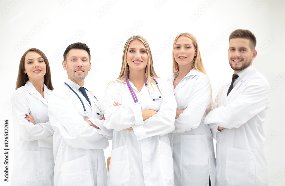 Team of medical professionals looking at camera, smiling. Team of medical professionals looking at camera, smiling.