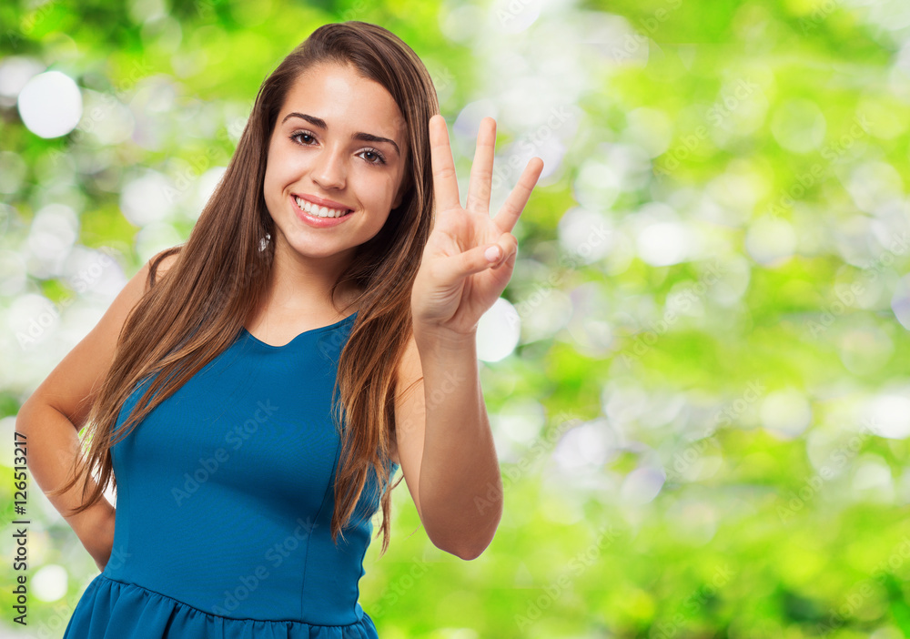 portrait of pretty young woman counting with her fingers portrait of pretty young woman counting with her fingers