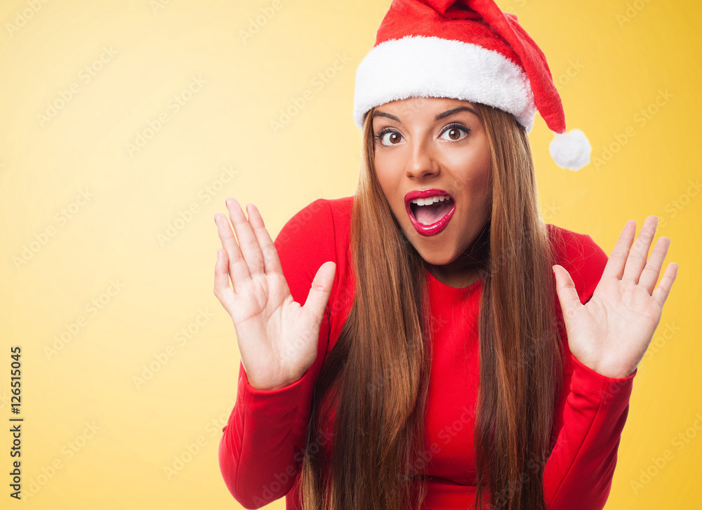portrait of a beautiful young woman with surprised gesture at Christmas portrait of a beautiful young woman with surprised gesture at Christmas