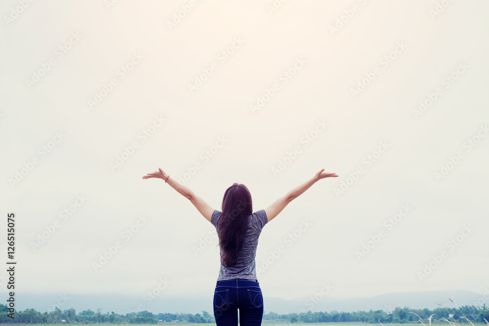 Young Asian fit woman relaxing with the river nature. open arms Young Asian fit woman relaxing with the river nature. open arms