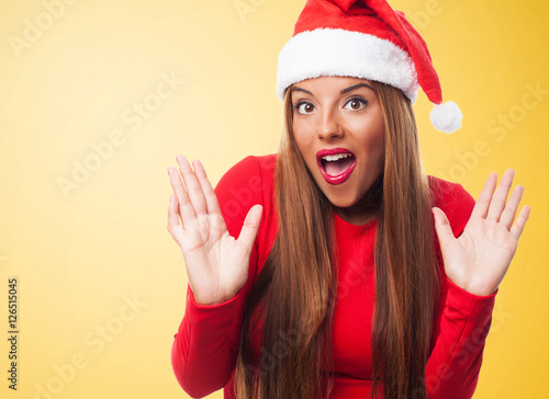 portrait of a beautiful young woman with surprised gesture at Christmas