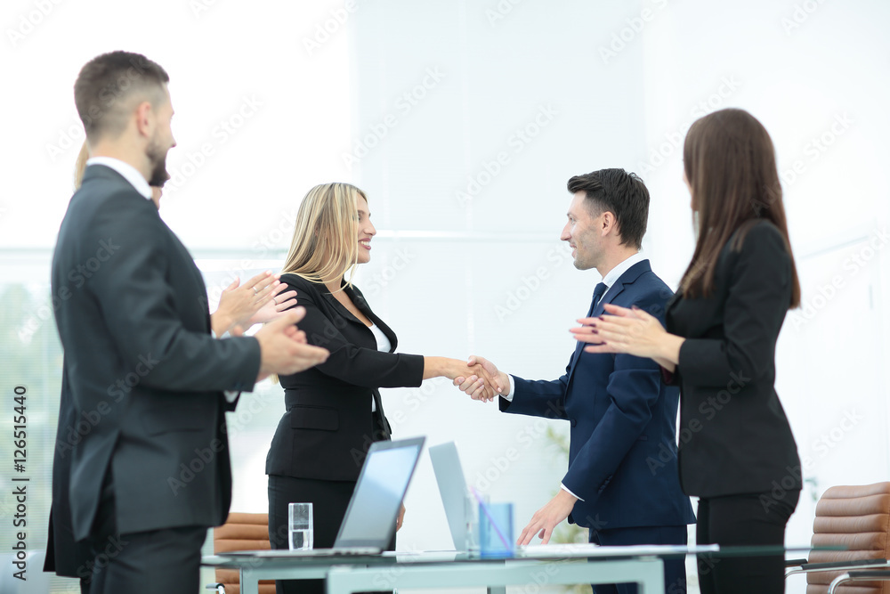 Fototapeta premium Business people shaking hands, finishing up a meeting