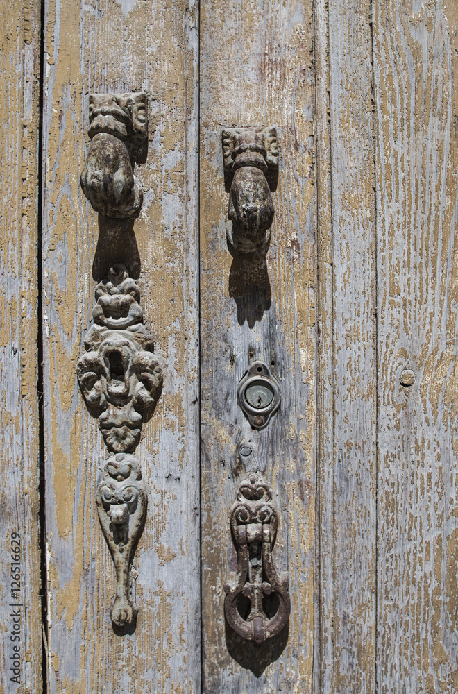 antique rusty lock in wooden door