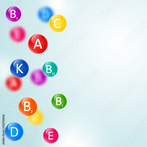 Medical blurred background with falling rainbow colored pills of vitamins