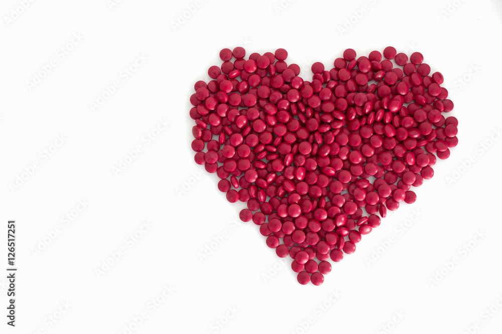 Big heart made from red and white tablets