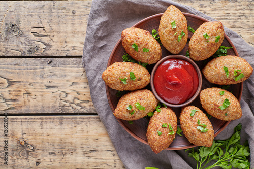 Kibbeh traditional middle eastern arabian lebanese restaurant lamb meat stuffed and bulgur kofta spicy meatball croquettes food on vintage wooden table background