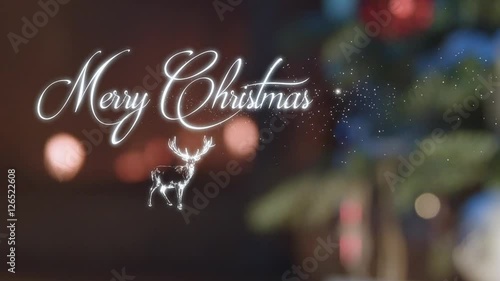Merry Christmas particle text over Christmas background