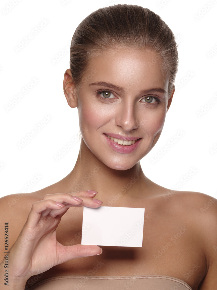 Portrait of an european young smiling girl with healthy perfect smooth skin, who is holding a business (visiting) card in her hand, studio shoot, white isolated background
Portrait of an european young smiling girl with healthy perfect smooth skin, who is holding a business (visiting) card in her hand, studio shoot, white isolated background