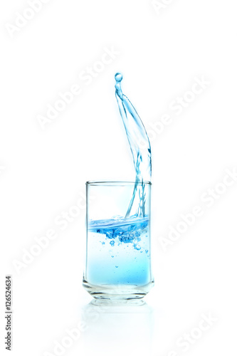 water splashing in transparent glass