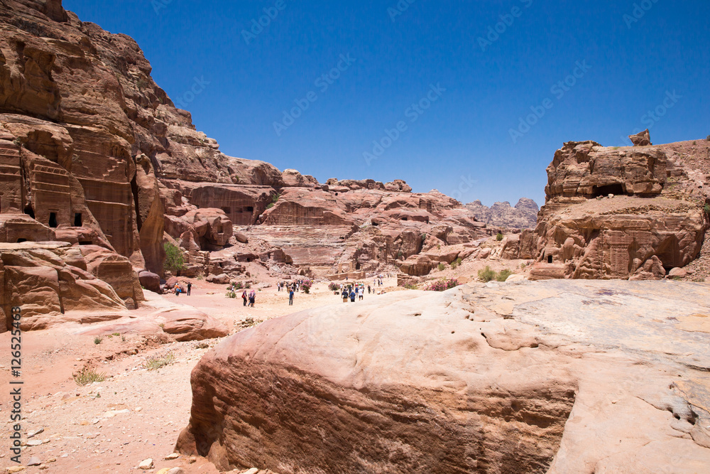 PETRA, JORDAN - APRIL 12, 2014: Unidentified people in front of PETRA, JORDAN - APRIL 12, 2014: Unidentified people in front of