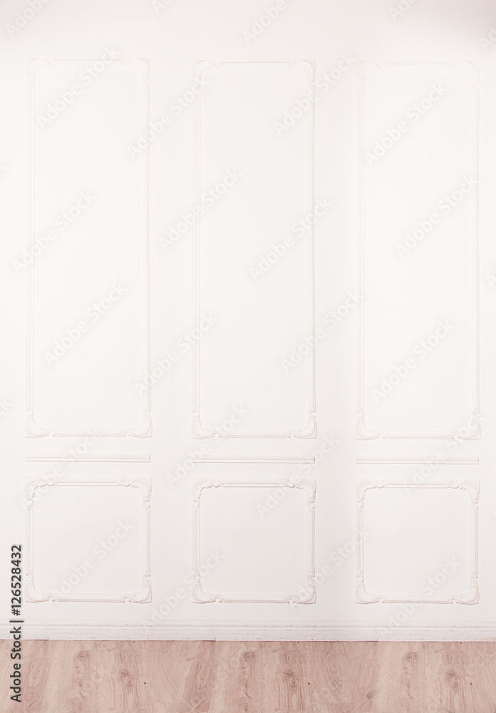 White wall decorated with stucco and molding in the style of Ren White wall decorated with stucco and molding in the style of Ren