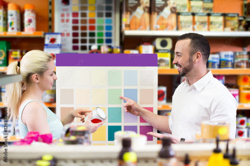 Man and woman picking paint color