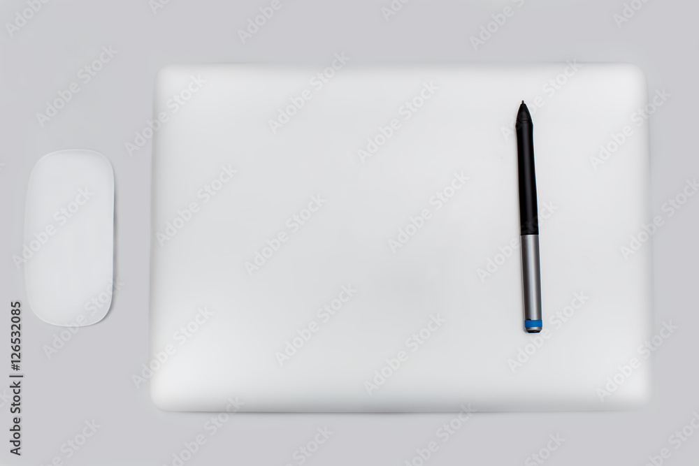 steel laptop on a light table steel laptop on a light table