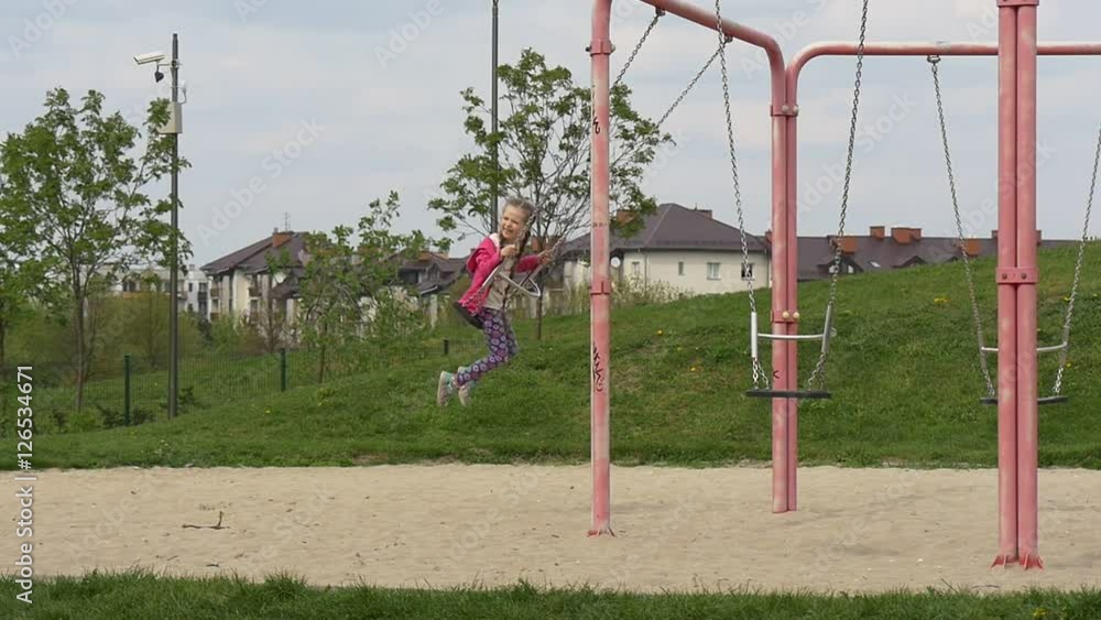 Sweet Girl Swinging on a Pink Swing. Sweet Girl Swinging on a Pink Swing.