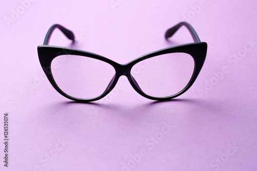 Black-rimmed glasses with clear lenses