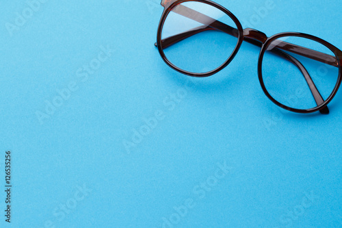 Brown-rim eyeglasses in empty background photo