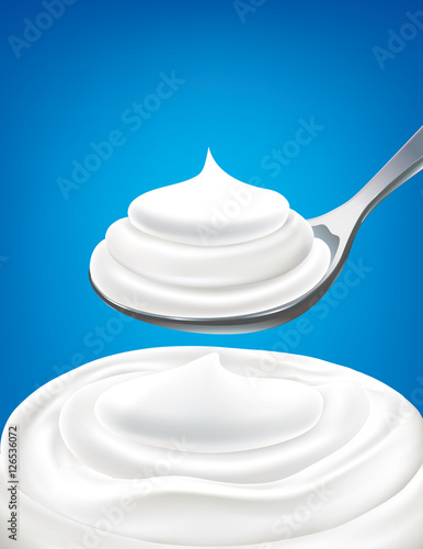 white milk yogurt cream on spoon